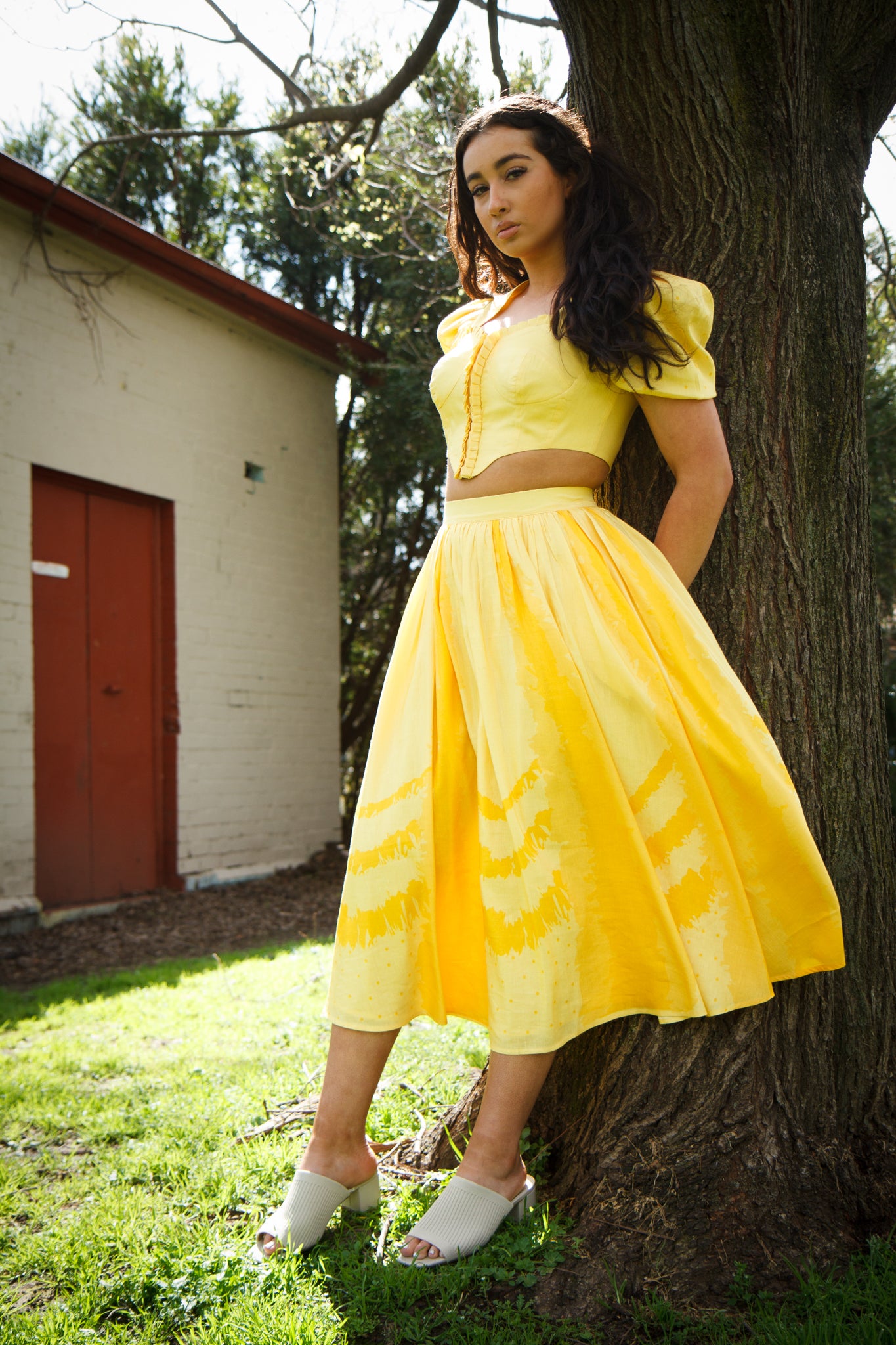 Short top yellow skirt